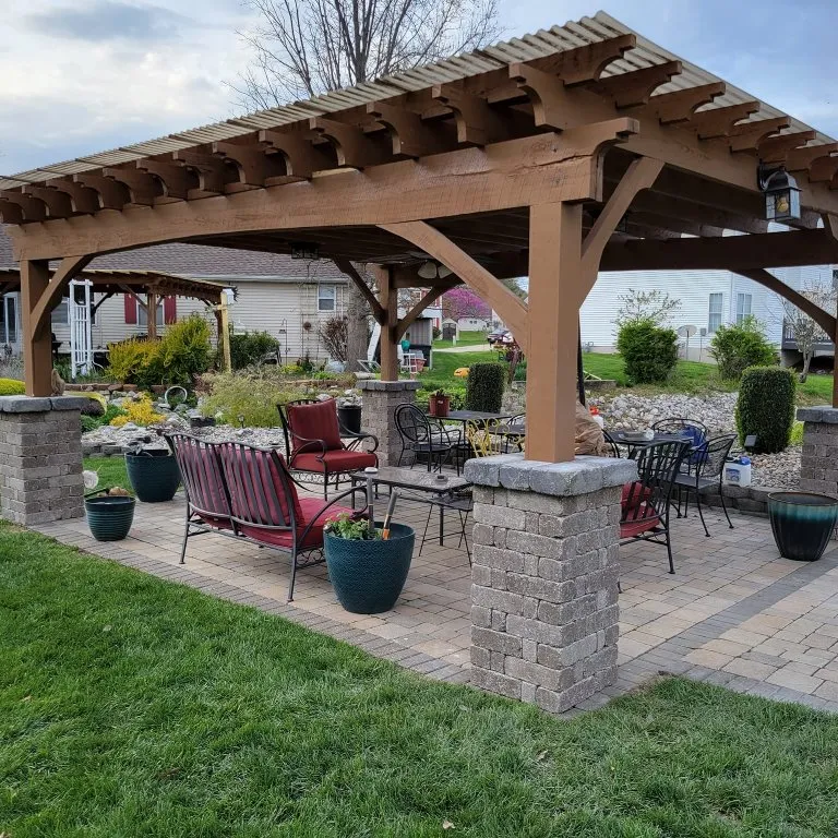 Raised paver patio with seating wall built for a Metro East home